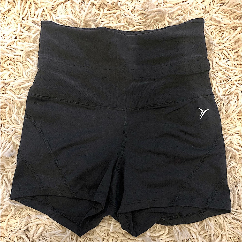 Athletic/yoga shorts. Top supports tummy or can be rolled down (see pic). S/XS.